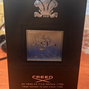 Creed Aventus Bottle and Box with Black and Silver Design